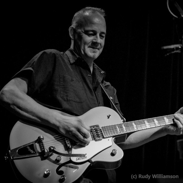 ken singing and playing guitar